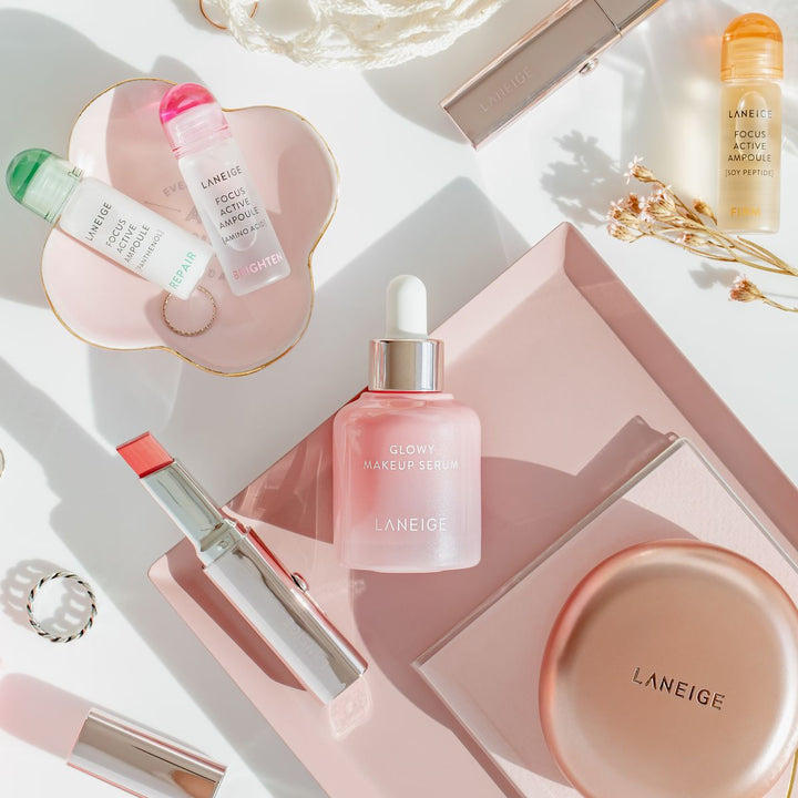 Pink Korean skincare and makeup flat lay